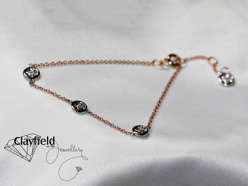 Beautiful Anklet on white silk background
