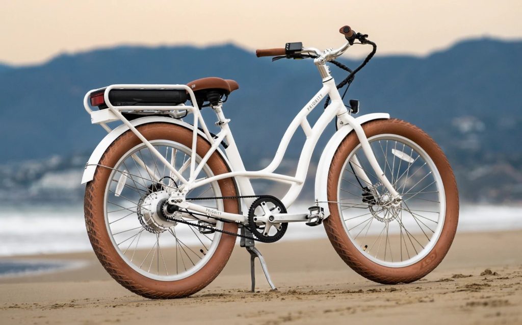 white belt driven bike on beach